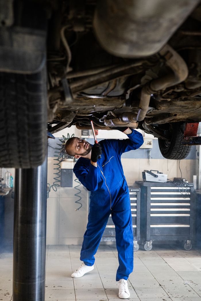 Samantha Reyes, diagnostics specialist, working on a car